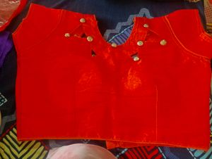 new and unused orange blouse