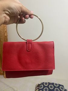 Red Ring Handle Clutch