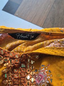 Elegant Yellow Kurta with Intricate Embellishments
