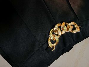 High rise Black Flare Pants with Gold Chain Detail