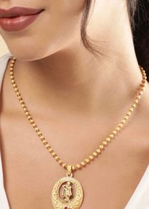 Elegant Gold Toned Pendant Necklace set