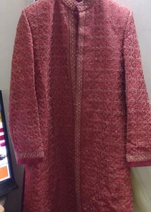 SHERWANI 36 SIZE RED COLOUR WITH HEAVY WORK IN IT FOR GRAND FUNCTIONS AND PARTIES READY TO USE CONDITION