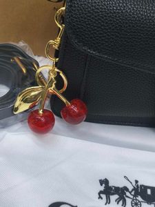 Coach Tabby Black 🖤 with cherry charm 🍒