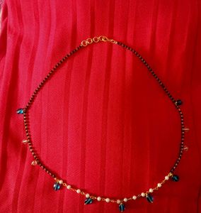 Elegant Black Bead Necklace with Blue Accents