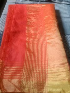 Vibrant Orange Saree with Golden Border