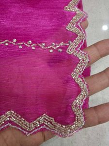 Vibrant Pink Saree with Intricate Embellishments