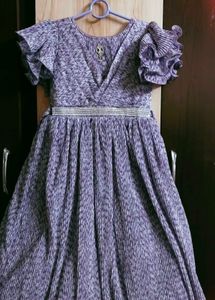Elegant Purple Pleated Gown with Embellished Belt