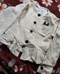 Cream Peplum Blouse with Black Buttons