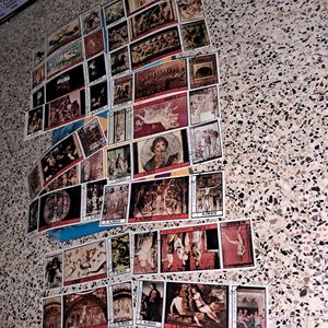 Collection of 54 vintage AJMAN painting stamps.