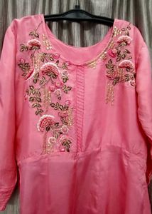 pink up and down top with embroidery