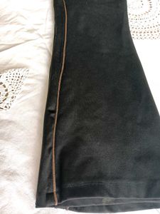 Chic Black Flared Pants with Subtle Stripe Detail