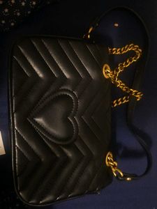 Chic Black Quilted Handbag with Gold Hardware