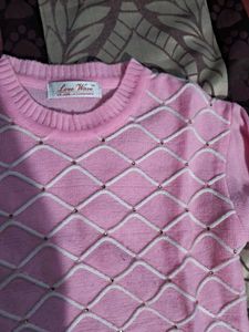 cute pink woole  top with white design and stones