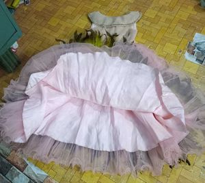 Sparkling Pink Tulle Gown with Feather Trim