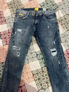 Distressed Blue Denim Jeans
