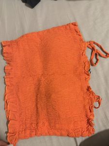 orange smocked sleeveless top