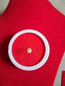 Gold Flower Nose Pin as earpressing