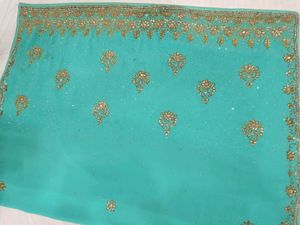 Exquisite Teal Saree with Golden Embellishments