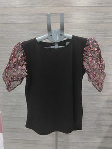 Chic Black Top with Floral Puff Sleeves
