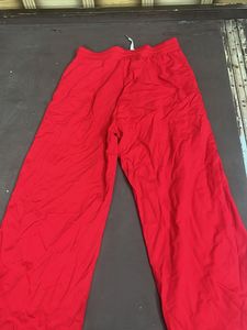 Red Wide-Leg Pants with Bold White Text
