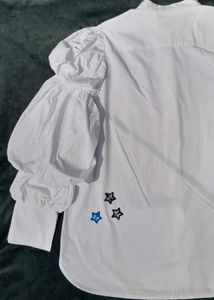 White balloon-sleeve shirt.