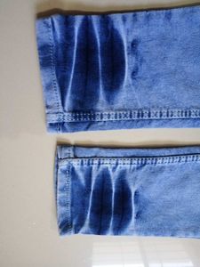 Distressed Blue Denim Jeans
