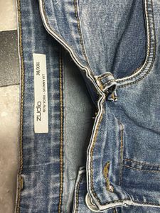Blue Denim Jeans with Distressed Detail