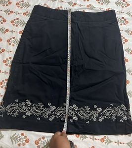 Chic Black Skirt with Embroidered Hem