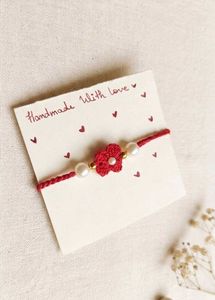 Elegant Red Blossom Crochet Rakhii