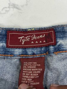 Light Wash Distressed Denim Jeans