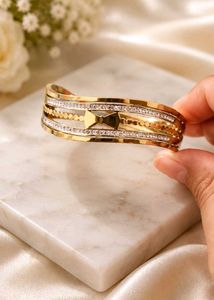 Elegant Gold Tone Bracelet with Crystals