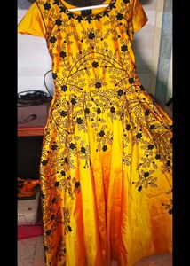 long yellow satin gown with black embroidery
