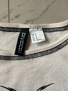 A symmetrical butterfly design crop top