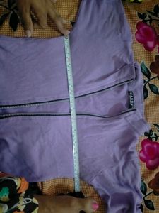 A Fitted Crop Top With Zip That Looks Super Cool