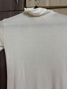 OZBRIDGE SHEER TURTLE NECK TOP