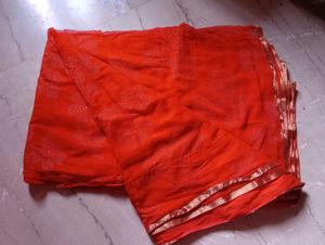 Orange Saree with Floral Embellishments