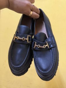 Chic Black Loafers with Gold Accent