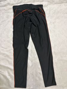 Nike Black Athletic Pants with Orange Stripe