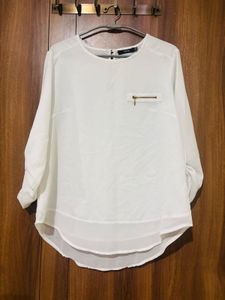 white top with black trousers