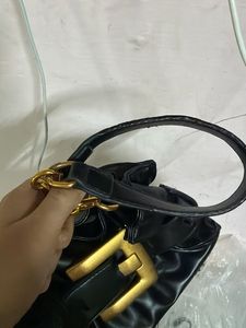 Chic Black Shoulder Bag with Gold Buckle