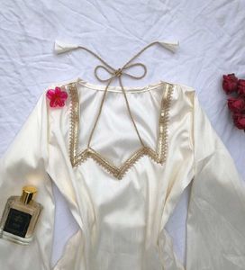 Elegant Off-White Corset Kurti with Dori neck