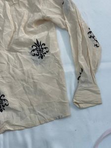 cream shirt