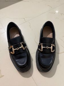 Chic Black Loafers with Gold Bit Detail