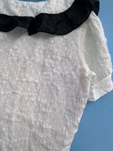 Chic White Top with Black Collar