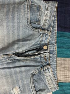 Ripped Knee Jeans