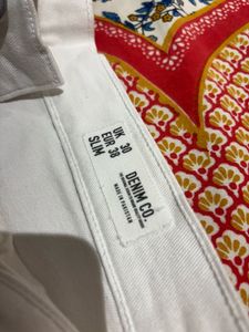 A pair of sexy white distressed shorts