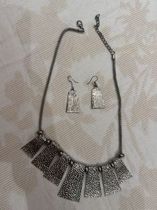 silver neck piece