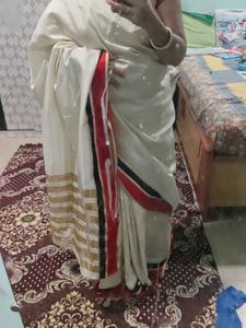 Elegant Cream Saree with Red and Black Border