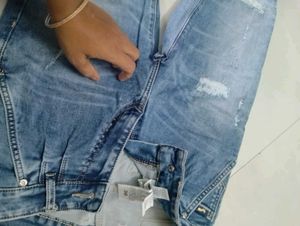 Distressed Light Wash Denim Jeans