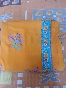 Beautiful Orange Saree with Floral Print